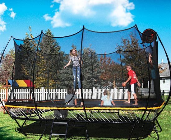 group of kids playing on trampoline